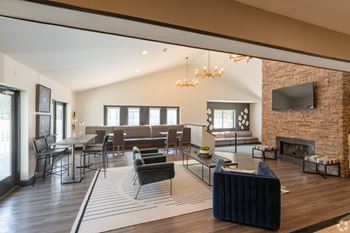A living room with a fireplace and a television